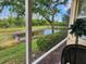 Relaxing screened lanai overlooking a serene pond, offering a peaceful outdoor retreat at 4213 Vicenza Dr # A2, Venice, FL 34293