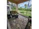 Spacious screened patio with comfortable seating, perfect for entertaining or enjoying the outdoors at 4213 Vicenza Dr # A2, Venice, FL 34293