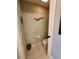 A compact toilet room showcasing unique mermaid-themed decor and a clean, tiled floor at 4213 Vicenza Dr # A2, Venice, FL 34293