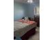 Cozy bedroom with natural light, ceiling fan, and a spacious bed at 469 Albee Farm Rd # V19, Venice, FL 34285