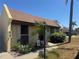 Charming single-story home with a well-manicured lawn and welcoming walkway at 469 Albee Farm Rd # V19, Venice, FL 34285