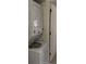 Efficient laundry area with stacked washer and dryer next to a doorway at 469 Albee Farm Rd # V19, Venice, FL 34285