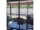 Screened lanai featuring neutral furniture, offering a cozy outdoor retreat at 469 Albee Farm Rd # V19, Venice, FL 34285