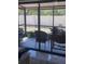 Enclosed sunroom with tile floors, comfortable seating, and views of the backyard at 469 Albee Farm Rd # V19, Venice, FL 34285