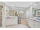 Spacious bathroom features double vanities, granite counters, a tub, and natural light at 4856 Jacaranda Heights Dr, Venice, FL 34293