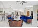 Spacious living room featuring an open floor plan, tile flooring, and comfortable seating at 4856 Jacaranda Heights Dr, Venice, FL 34293