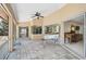 Covered patio features large sliding glass doors and views of the surrounding landscaping at 4856 Jacaranda Heights Dr, Venice, FL 34293