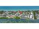 Aerial shot of the property, showcasing its proximity to the beach and surrounding neighborhood in a waterfront community at 5031 N Beach Rd # 118, Englewood, FL 34223
