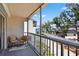 Relaxing balcony area showcasing seating, a scenic view of the neighborhood, and a tranquil outdoor space at 5031 N Beach Rd # 118, Englewood, FL 34223