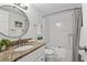 Well-lit bathroom boasting granite counters, a modern sink, and a shower-tub combo for convenience at 5031 N Beach Rd # 118, Englewood, FL 34223