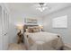 Cozy bedroom with neutral tones, soft lighting, and a comfortable bed for a relaxing ambiance at 5031 N Beach Rd # 118, Englewood, FL 34223