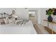 Bright bedroom featuring stylish decor, comfortable bedding, and an en-suite bathroom view for added convenience at 5031 N Beach Rd # 118, Englewood, FL 34223