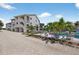 Exterior view showcases the property's pool area and its surrounding fence, offering a glimpse into the outdoor amenities at 5031 N Beach Rd # 118, Englewood, FL 34223