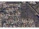 Residential area featuring lush tree cover with a neighborhood street layout at 5106 S Lockwood Ridge Rd, Sarasota, FL 34231