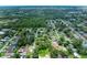 Aerial view of a residential neighborhood with tree-lined streets and well-kept homes at 5106 S Lockwood Ridge Rd, Sarasota, FL 34231