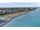 Expansive aerial view featuring white sandy beach, crystal blue water and a stunning coastline at 525 Manatee Ct # 13, Venice, FL 34285