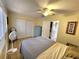 Well-lit bedroom with a ceiling fan, closet, and tile flooring at 525 Manatee Ct # 13, Venice, FL 34285