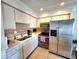 Updated kitchen featuring stainless steel appliances and bright cabinetry at 525 Manatee Ct # 13, Venice, FL 34285