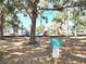 Playground equipment visible through trees, adjacent to sign for Prentiss French Park at 525 Manatee Ct # 13, Venice, FL 34285