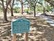 Sign with text about Prentiss French Park, surrounded by trees and grass at 525 Manatee Ct # 13, Venice, FL 34285