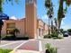 Exterior view of Venice Theatre with palm trees and blue sky at 525 Manatee Ct # 13, Venice, FL 34285