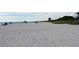 Expansive sandy beach view with gentle waves meeting the shore on a sunny day at 5264 Albion Rd, Venice, FL 34293