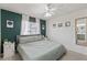 Charming bedroom with stylish green accent wall and bright natural light at 5264 Albion Rd, Venice, FL 34293