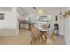 Inviting dining area featuring seating for four and views of the kitchen and back patio at 5264 Albion Rd, Venice, FL 34293