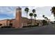 Exterior view of Venice Theatre featuring Spanish architecture and palm trees at 5264 Albion Rd, Venice, FL 34293