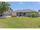 Well-maintained home with green lawn, established landscaping and attached garage at 5264 Albion Rd, Venice, FL 34293