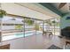 Relaxing lanai features a screen, comfortable seating, and a view of the pool at 5264 Albion Rd, Venice, FL 34293
