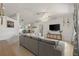 Spacious living area features an open floor plan, TV, and a seamless transition to the dining area at 5264 Albion Rd, Venice, FL 34293