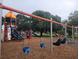 Colorful playground with slides and swings, showcasing a fun and active play space at 5264 Albion Rd, Venice, FL 34293