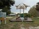 Tot lot playground designed for smaller children, featuring shade and play equipment at 5264 Albion Rd, Venice, FL 34293