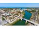 Aerial view of a city with waterways, bridges, and buildings, showcasing the coastal landscape at 5856 Semolino St, Nokomis, FL 34275