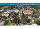 A vibrant city aerial view with coastal scenery and streets lined with trees and commercial properties at 5856 Semolino St, Nokomis, FL 34275