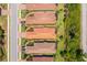 Overhead view of houses with tile roofs and lanais in a well-maintained community at 5856 Semolino St, Nokomis, FL 34275