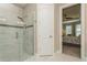 Bathroom features a walk-in shower and view into the bedroom at 5856 Semolino St, Nokomis, FL 34275