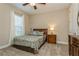 Comfortable bedroom boasts great natural light and calming neutral colors at 5856 Semolino St, Nokomis, FL 34275