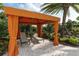 Secluded cabana with comfortable lounge chairs provides the perfect place to relax by the pool at 5856 Semolino St, Nokomis, FL 34275