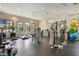 Bright gym features modern equipment, rubber floors, ceiling fans, and large mirrors at 5856 Semolino St, Nokomis, FL 34275