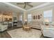 Open living area boasts wood floors and seamlessly connects to the modern kitchen at 5856 Semolino St, Nokomis, FL 34275