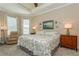 Relaxing main bedroom with sitting area, windows, and decorative coastal accents at 5856 Semolino St, Nokomis, FL 34275