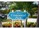 Centennial Park sign surrounded by tropical foliage and greenery in a landscaped setting at 5856 Semolino St, Nokomis, FL 34275