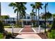 Downtown streetscape featuring shops, restaurants, and pedestrian crosswalk with palm trees at 5856 Semolino St, Nokomis, FL 34275