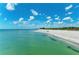 Stunning aerial view of a serene beach with clear turquoise water meeting a sandy shore at 5868 Jefferson Rd, Venice, FL 34293