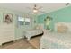 Charming bedroom with twin beds, coastal decor, and ample natural light at 5868 Jefferson Rd, Venice, FL 34293