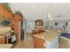 Open kitchen with granite countertops, stainless steel appliances, and a breakfast bar at 5868 Jefferson Rd, Venice, FL 34293