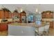 Spacious kitchen featuring a granite countertop, stainless steel appliances, and seating at the island at 5868 Jefferson Rd, Venice, FL 34293