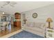 Comfortable living room with a cozy sofa, stylish decor, and seamless access to the outdoor area at 5868 Jefferson Rd, Venice, FL 34293